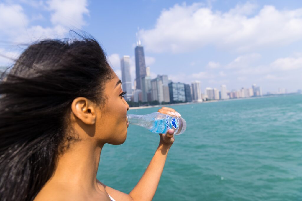 woman drinking water from bottle