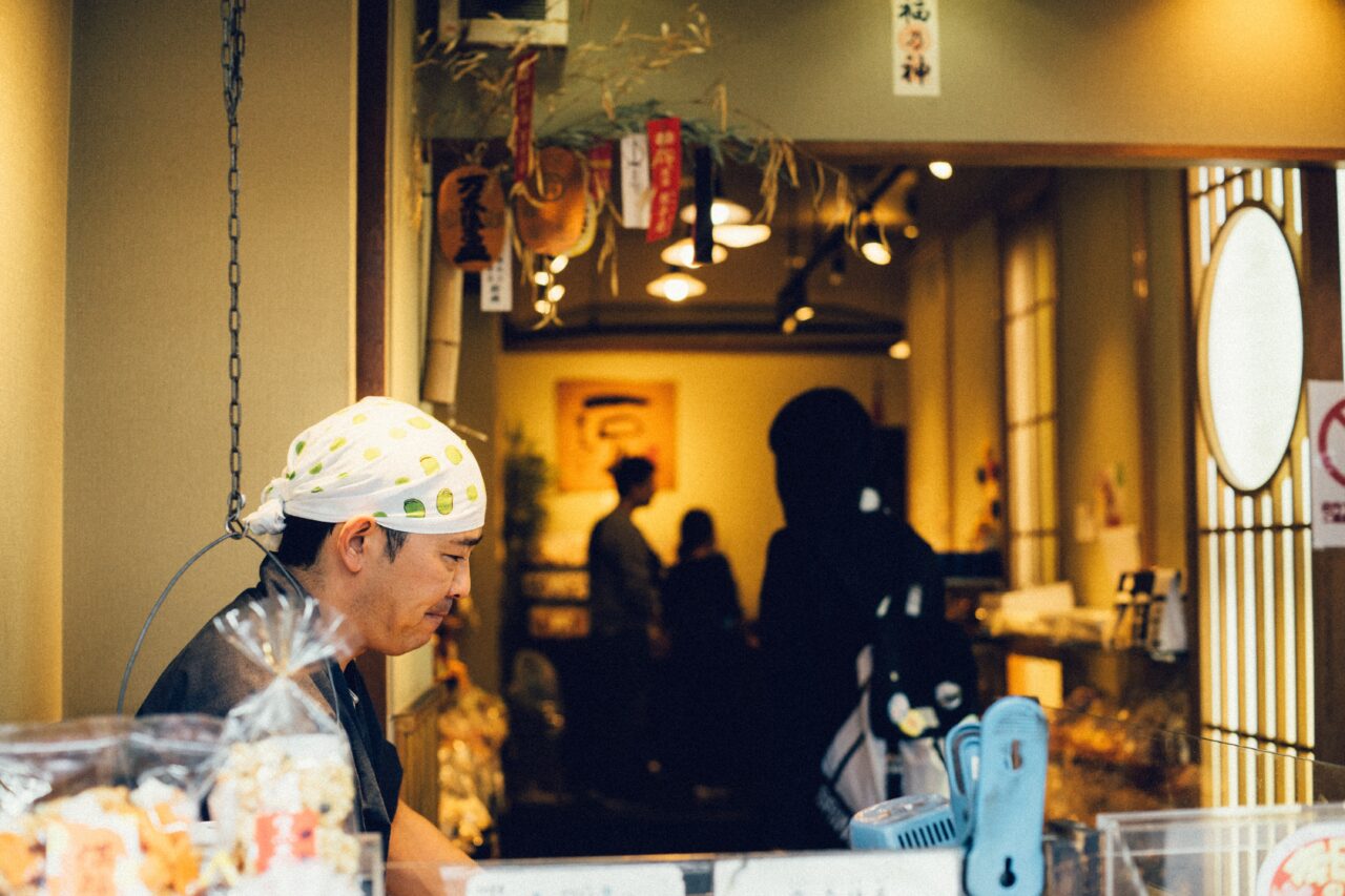 man standing on a restaurant's counter